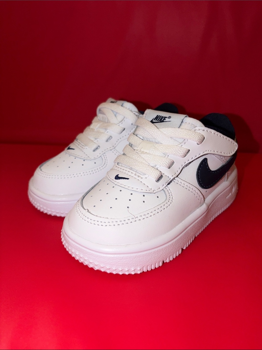 Nike Kids White Sneakers with Black Swoosh